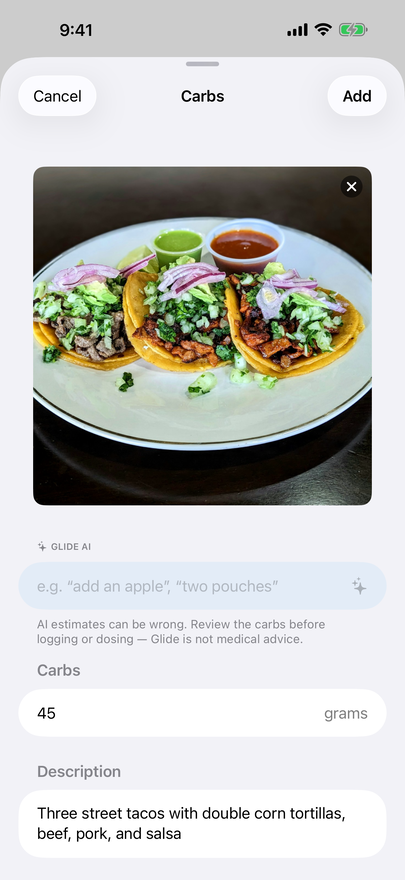 A photo of three street tacos with an AI carb estimate of 45 grams in an editable field