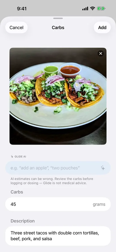 A photo of three street tacos with an AI carb estimate of 45 grams in an editable field